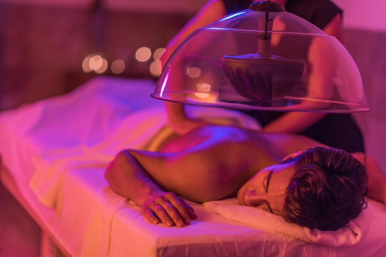 Hard Rock Hotel Goa Calangute Bagian luar foto A patient receiving a cupping treatment
