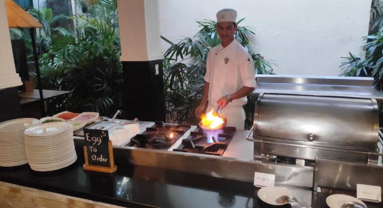 Hard Rock Hotel Goa Calangute Bagian luar foto A chef cooking with a blowtorch